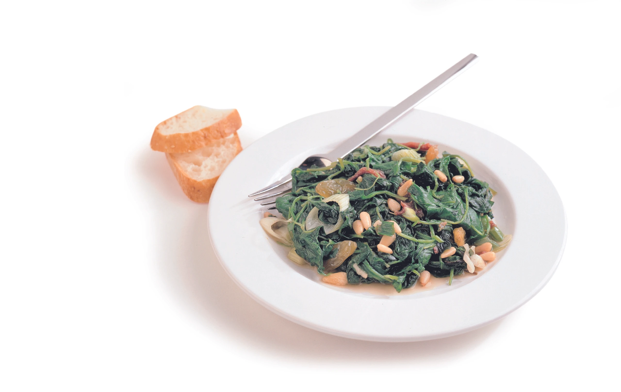 Italienischer Blattspinat mit Pignoli