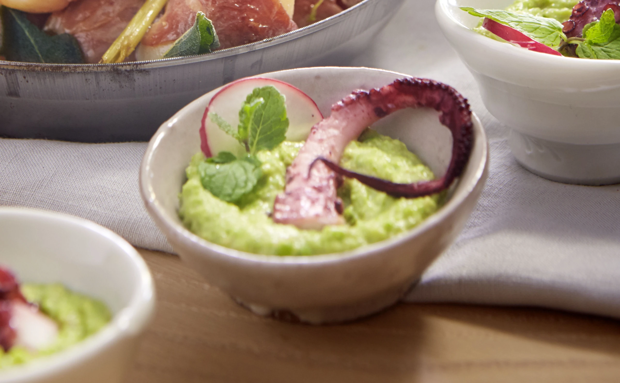 Pulpo mit Erbsen-Speck-Mash